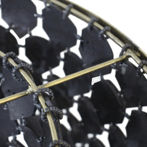Piatos Hanging Lamp made from natural coconut shell with a black finish and brass frame, handcrafted sustainable lighting. Close up perspective 1