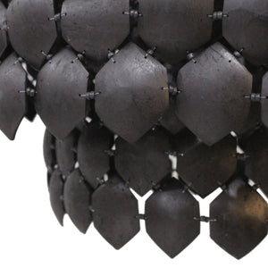 Piatos Hanging Lamp made from natural coconut shell with a black finish and brass frame, handcrafted sustainable lighting. Close up perspective