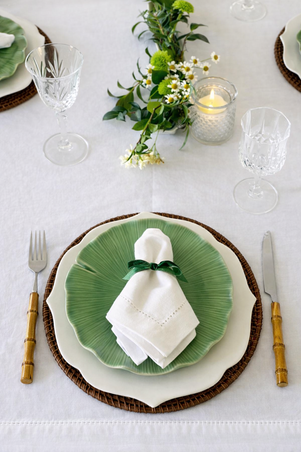 Espresso rattan woven placemat styled with white dinner plate and linen napkin on wooden table – Magnolia Lane table styling