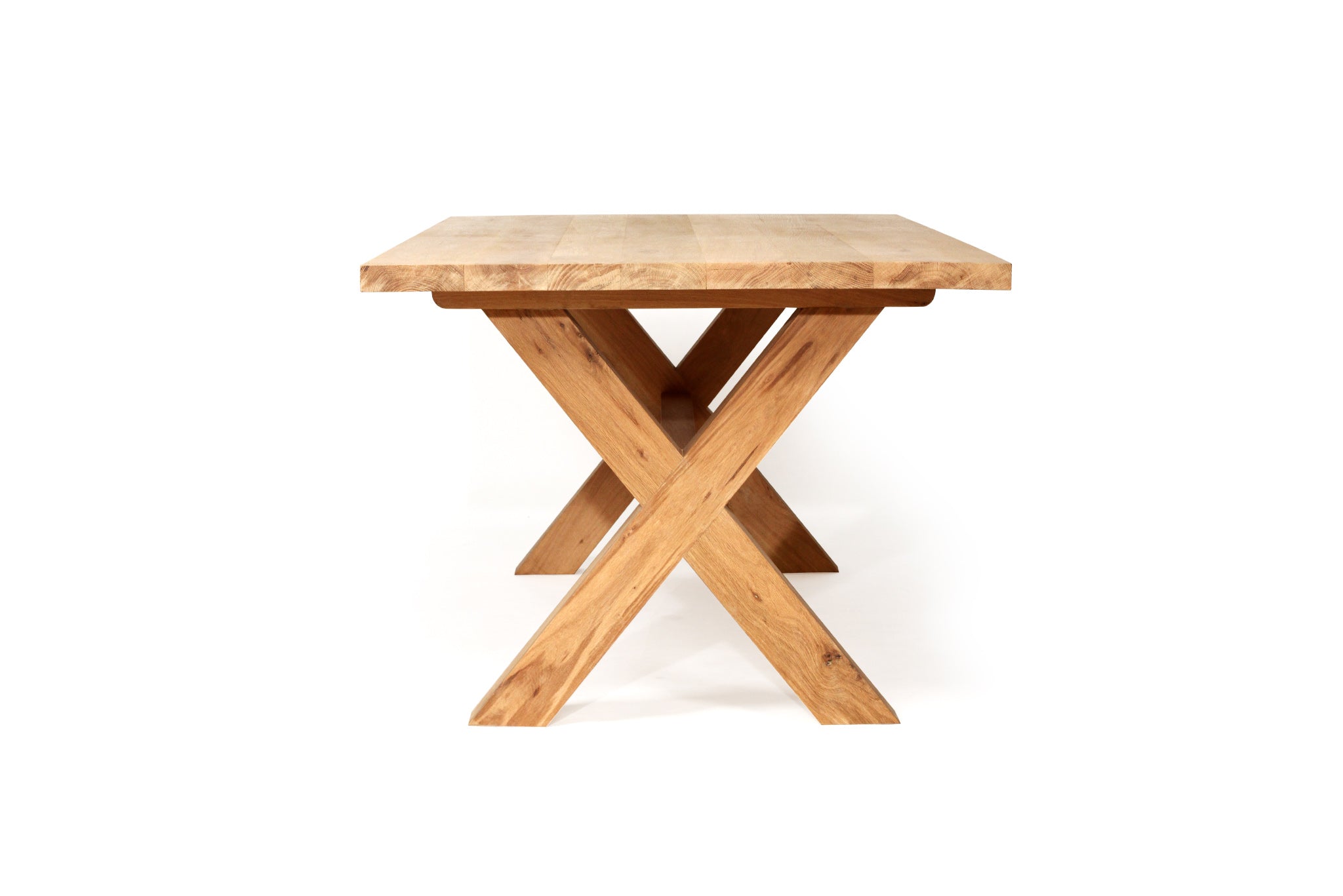 Surfer Dining Table made from premium A-Grade American Oak with a natural raw finish, perfect for elegant Sunday meals with family. Side view