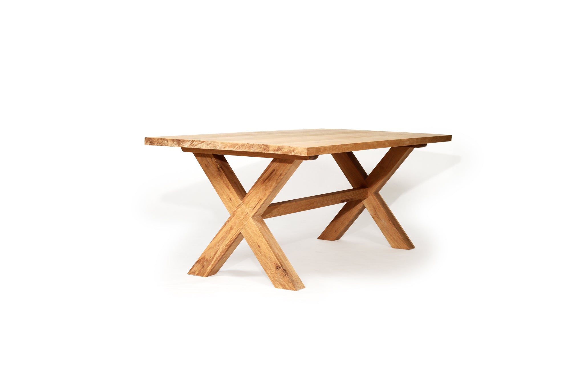 Surfer Dining Table made from premium A-Grade American Oak with a natural raw finish, perfect for elegant Sunday meals with family. Side angle perspective