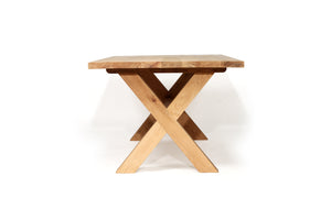 Surfer Dining Table made from premium A-Grade American Oak with a natural raw finish, perfect for elegant Sunday meals with family. Side view 1