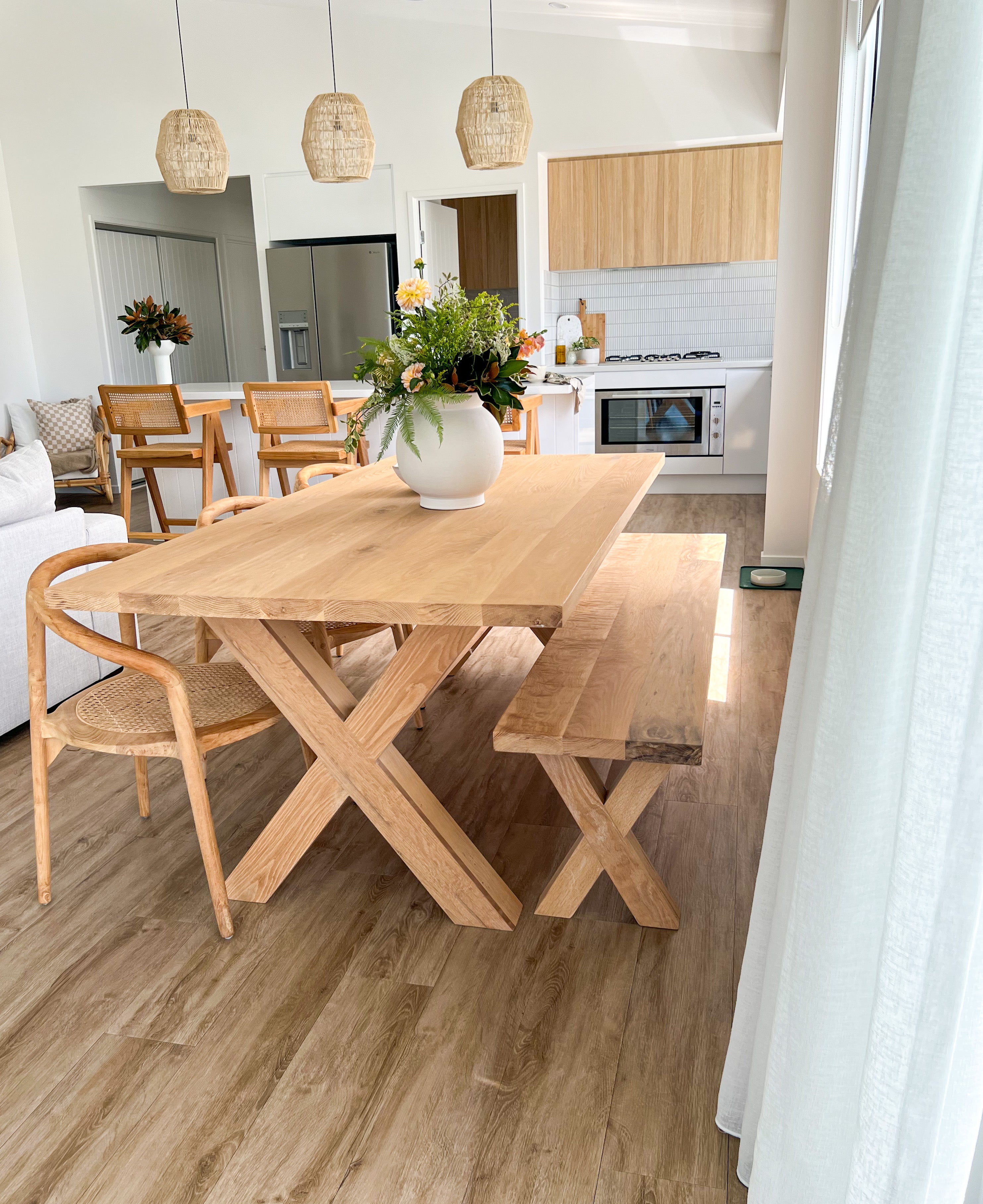 Surfer Dining Table made from premium A-Grade American Oak with a natural raw finish, perfect for elegant Sunday meals with family. Styled in this beautiful coastal home 2