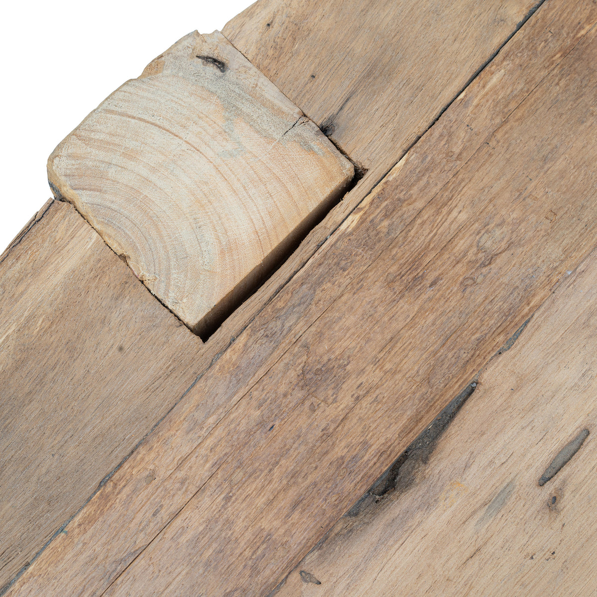 Reclaimed timber coffee table showing natural variation in tone from light to darker bleached wood finishes