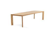 Load image into Gallery viewer, Great Teak Dining Table in A-grade teak with a natural brushed finish, offering exceptional durability and timeless elegance—also available in American Oak. Side angle view 1