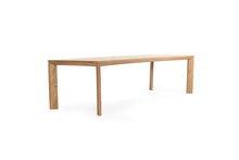 Load image into Gallery viewer, Great Teak Dining Table in A-grade teak with a natural brushed finish, offering exceptional durability and timeless elegance—also available in American Oak. Side angle view 2