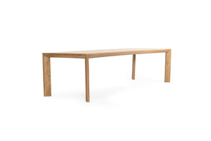 Great Teak Dining Table in A-grade teak with a natural brushed finish, offering exceptional durability and timeless elegance—also available in American Oak. Side angle view 2