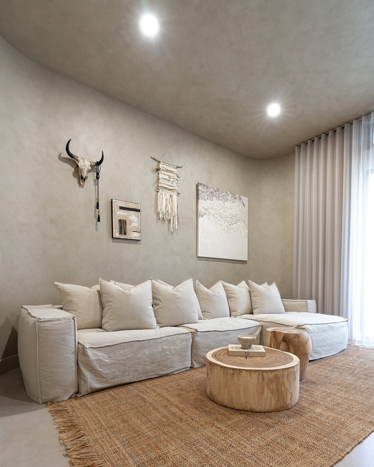 Natural Trunk Coffee Table styled with a linen sectional sofa in a neutral living room