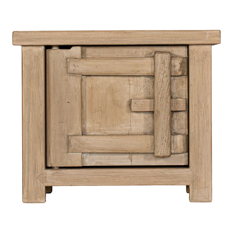 Bulu Bedside Table with left-hand door, handcrafted from reclaimed timber with natural weathered texture and carved details, coastal organic furniture with timeless character.
