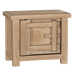Bulu Bedside Table with left-hand door, handcrafted from reclaimed timber with natural weathered texture and carved details, coastal organic furniture with timeless character. Left hand perspective.
