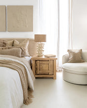 Load image into Gallery viewer, Bulu Bedside Table with right-hand door, handcrafted from reclaimed timber with natural weathered texture and carved details, coastal organic furniture with timeless character.  Modern coastal luxe bedroom interior.