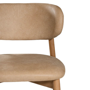 Capri Dining Chair in Enoki by Uniqwa – luxury modern style with buffalo leather upholstery and white oak frame, ideal for refined residential or commercial interiors. Detail view 1