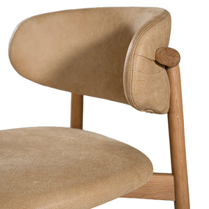 Capri Dining Chair in Savannah Nut by Uniqwa – luxury modern style with buffalo leather upholstery and white oak frame, ideal for refined residential or commercial interiors. Leather detail