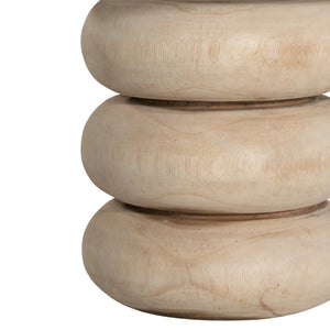 Rundu Table Lamp handcrafted from solid munggur wood with hand-carved textured grooves, showcasing natural wood variations and a soft ambient glow. Close up on natural base.