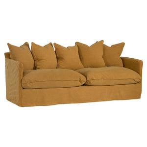 Singita Three Seater Sofa with hardwood frame, feather-filled cushions and removable slipcovers in luxury linen in ochre.