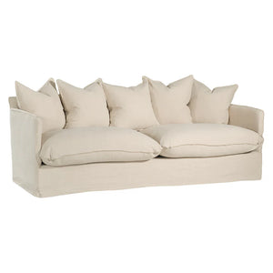 Singita Three Seater Sofa with hardwood frame, feather-filled cushions and removable slipcovers in luxury linen in sand.