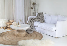 Load image into Gallery viewer, Singita Three Seater Sofa with hardwood frame, feather-filled cushions and removable slipcovers in luxury linen in white. Styled beautifully in this coastal home.