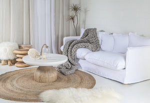 Singita Three Seater Sofa with hardwood frame, feather-filled cushions and removable slipcovers in luxury linen in white. Styled beautifully in this coastal home.