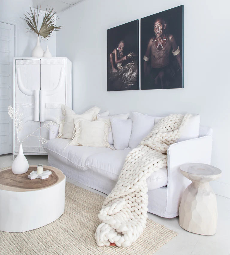 Singita Three Seater Sofa with hardwood frame, feather-filled cushions and removable slipcovers in luxury linen in white.  Styled perfectly in this tribal luxe interior.