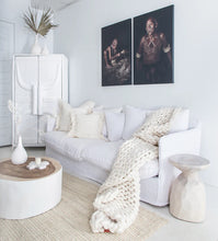 Load image into Gallery viewer, Singita Three Seater Sofa with hardwood frame, feather-filled cushions and removable slipcovers in luxury linen in white.  Styled perfectly in this tribal luxe interior.