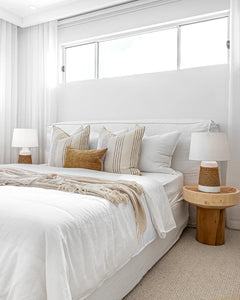 Hendrix Bedhead with feather cushioning and removable linen slipcover, timber frame upholstered bedhead for modern coastal bedroom style.  Beautifully styled in this modern coastal bedroom space.