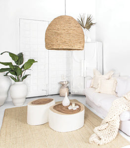 Singita Four Seater Sofa by Uniqwa with hardwood frame, feather-filled cushions and removable slipcovers in luxury linen in white. Styled beautifully in this tribal luxe interior.