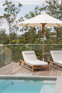 Vaucluse Outdoor Sunlounger in Grade A teak with white Sunbrella cushion, adjustable backrest and wheels, durable coastal outdoor furniture for poolside or garden relaxation.  Magnolia Lane coastal style living.