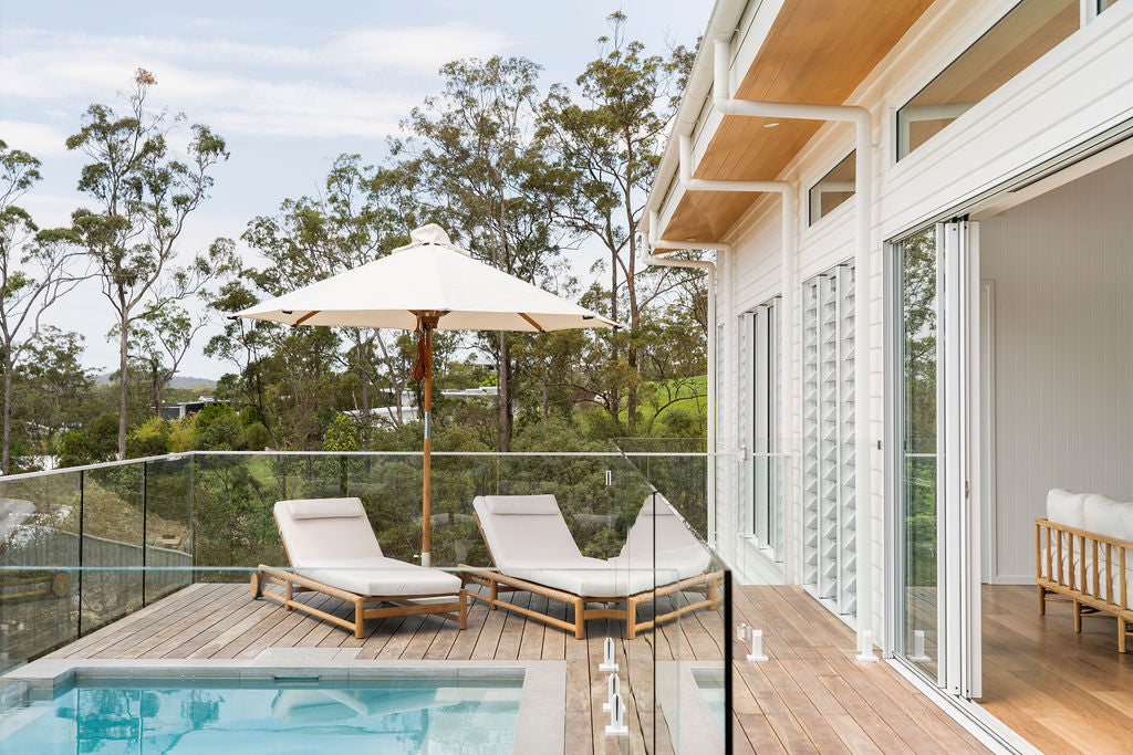 Vaucluse Outdoor Sunlounger in Grade A teak with white Sunbrella cushion, adjustable backrest and wheels, durable coastal outdoor furniture for poolside or garden relaxation.  Coastal style living.