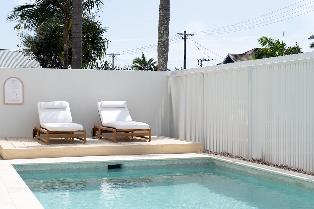Vaucluse Outdoor Sunlounger in Grade A teak with white Sunbrella cushion, adjustable backrest and wheels, durable coastal outdoor furniture for poolside or garden relaxation.  Magnolia Lane resort style living at home.