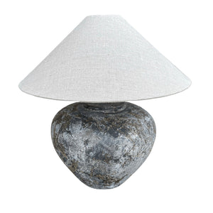 The Villa Table Lamp featuring an organic, rustic design with a natural shade and sculptural base, adding earthy elegance to any space.