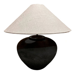 The Villa Table Lamp featuring an organic, rustic design with a natural shade and sculptural base, adding elegance to any space.