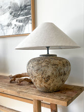 Load image into Gallery viewer, The Villa Table Lamp featuring an organic, rustic design with a natural shade and sculptural base, adding earthy elegance to any space. Wabi Sabi style, Magnolia Lane. Styled beautifully in this modern coastal interior.