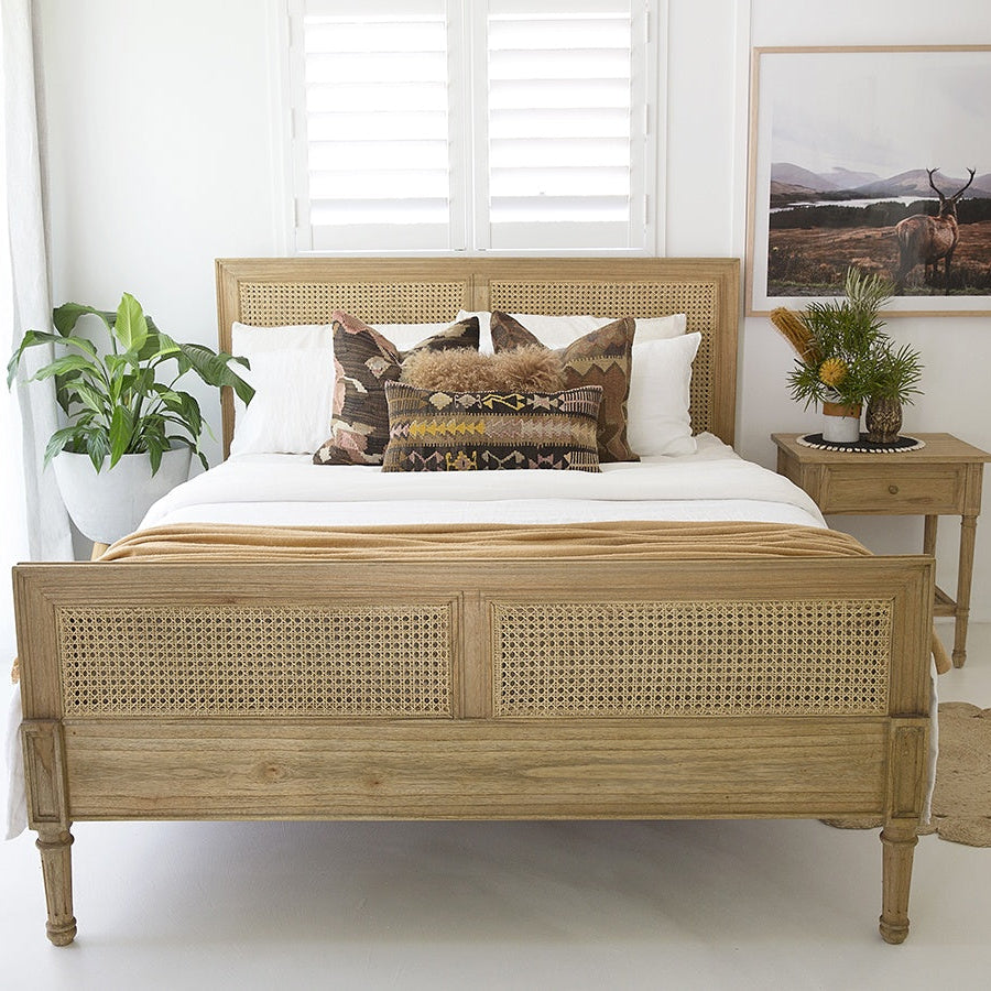 Whitsunday Cane Bed styled in a coastal Australian bedroom with neutral tones and natural textures