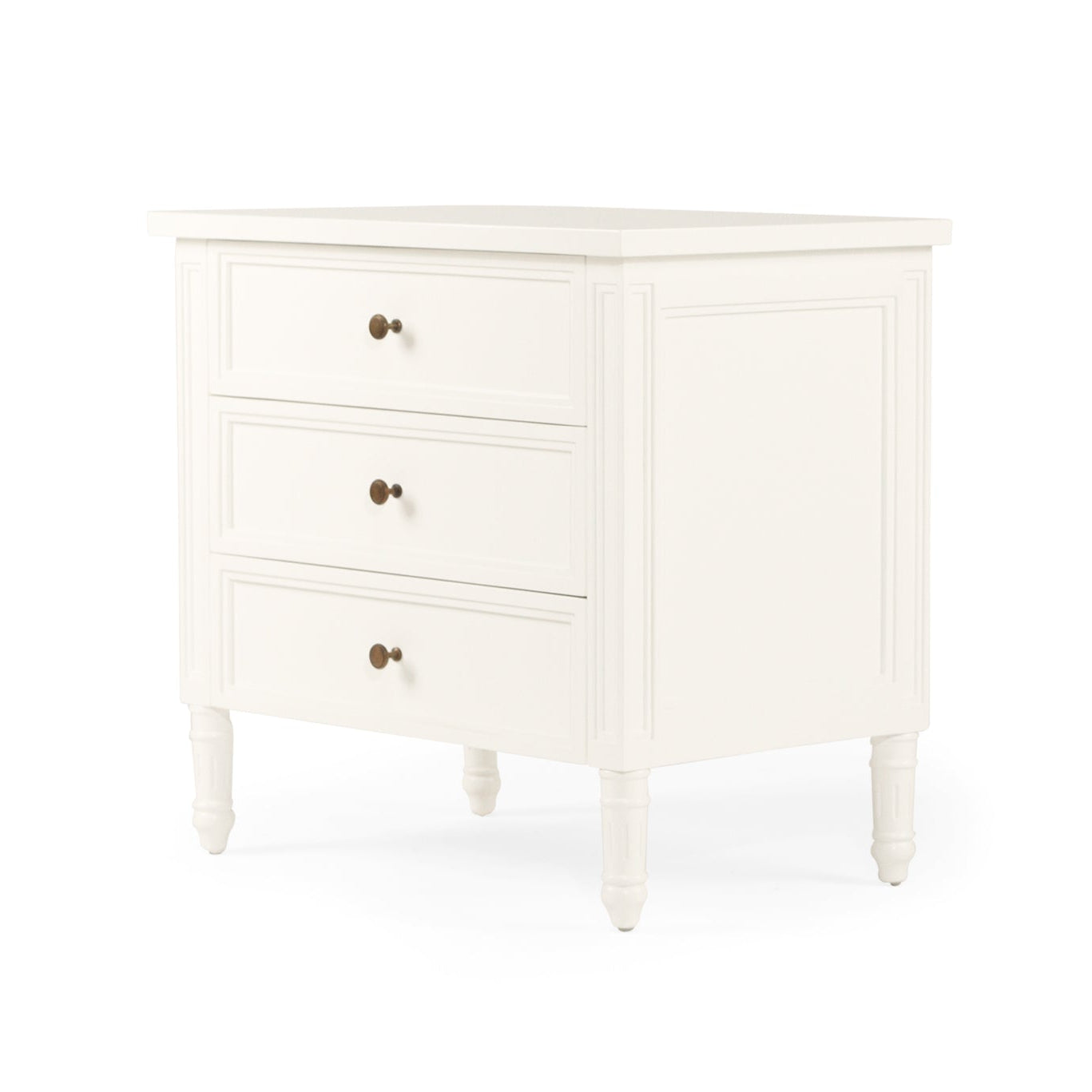White coastal bedside table with three drawers and fluted legs angled view