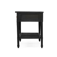 Load image into Gallery viewer, Whitsunday Wide Nightstand in black, solid hardwood bedside table with single drawer and cane shelf, classic coastal bedroom furniture with beachside charm. Side perspective.