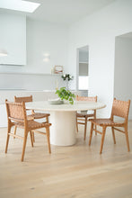 Load image into Gallery viewer, Dining chair with natural woven leather straps and sleek modern design, crafted for style and comfort. Styled perfectly in this modern coastal home.  Magnolia Lane 1