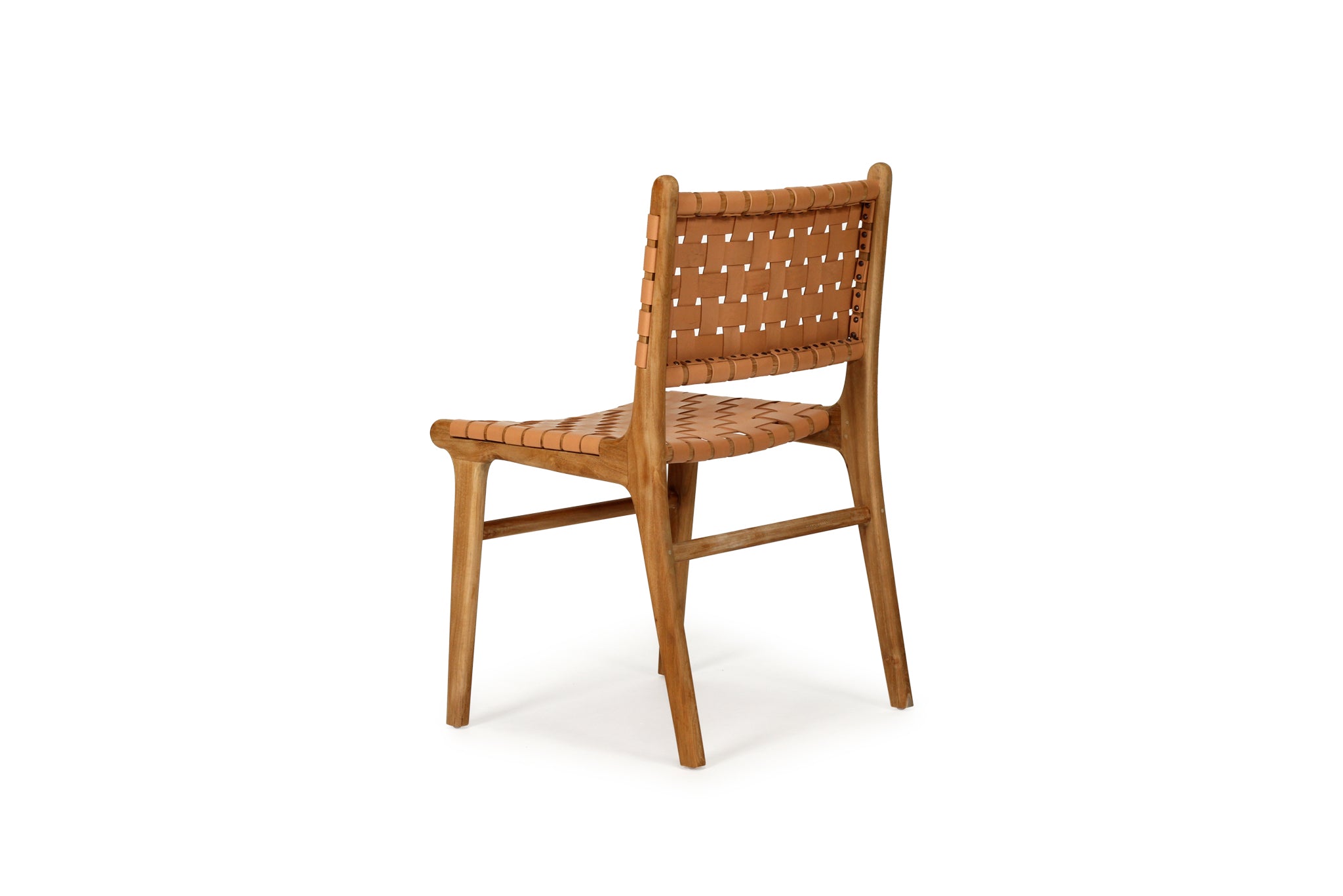 Dining chair with natural woven leather straps and sleek modern design, crafted for style and comfort. Back angle perspective. Magnolia Lane