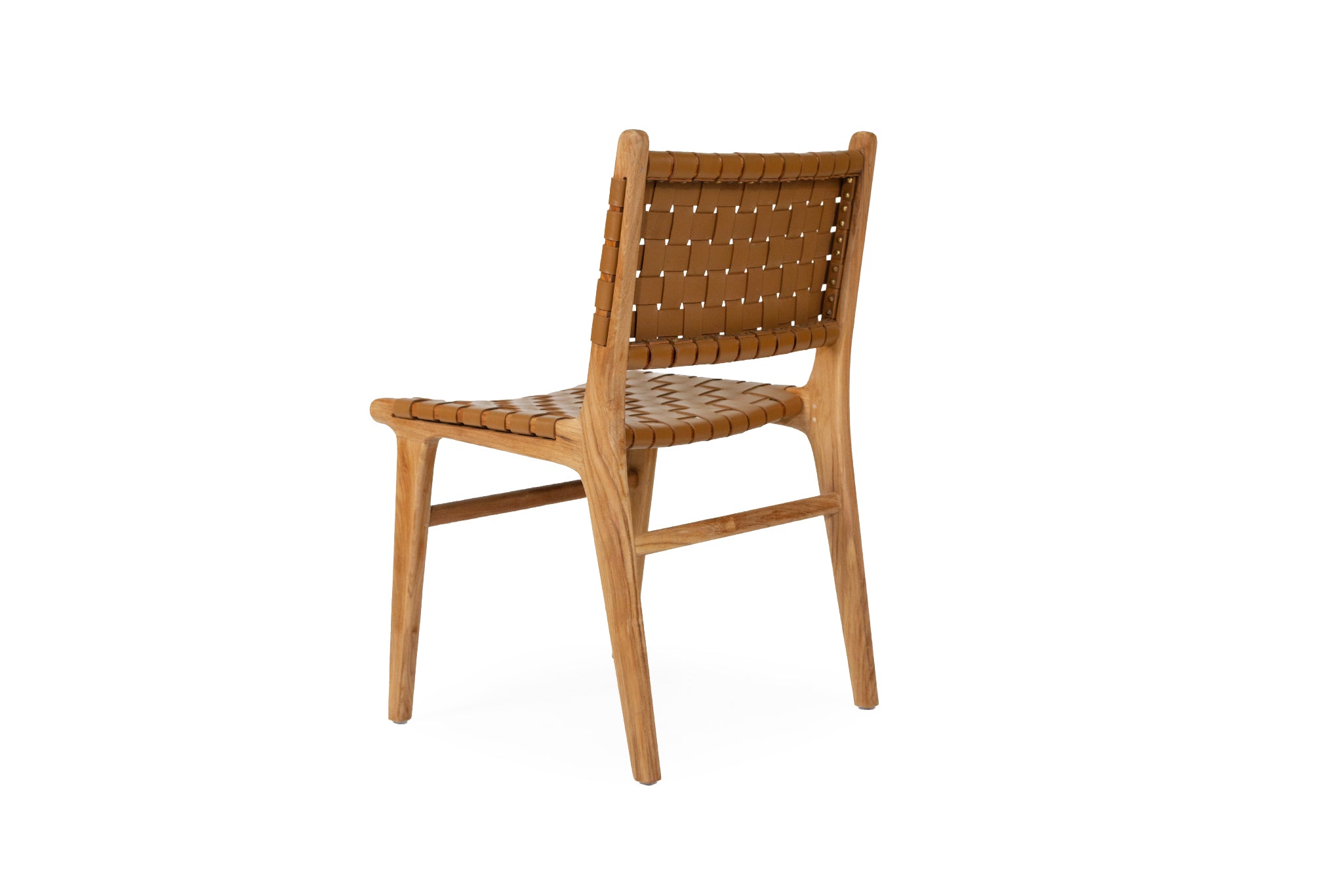 Dining chair with woven leather straps and sleek modern design, crafted for style and comfort. Back angle perspective. Magnolia Lane