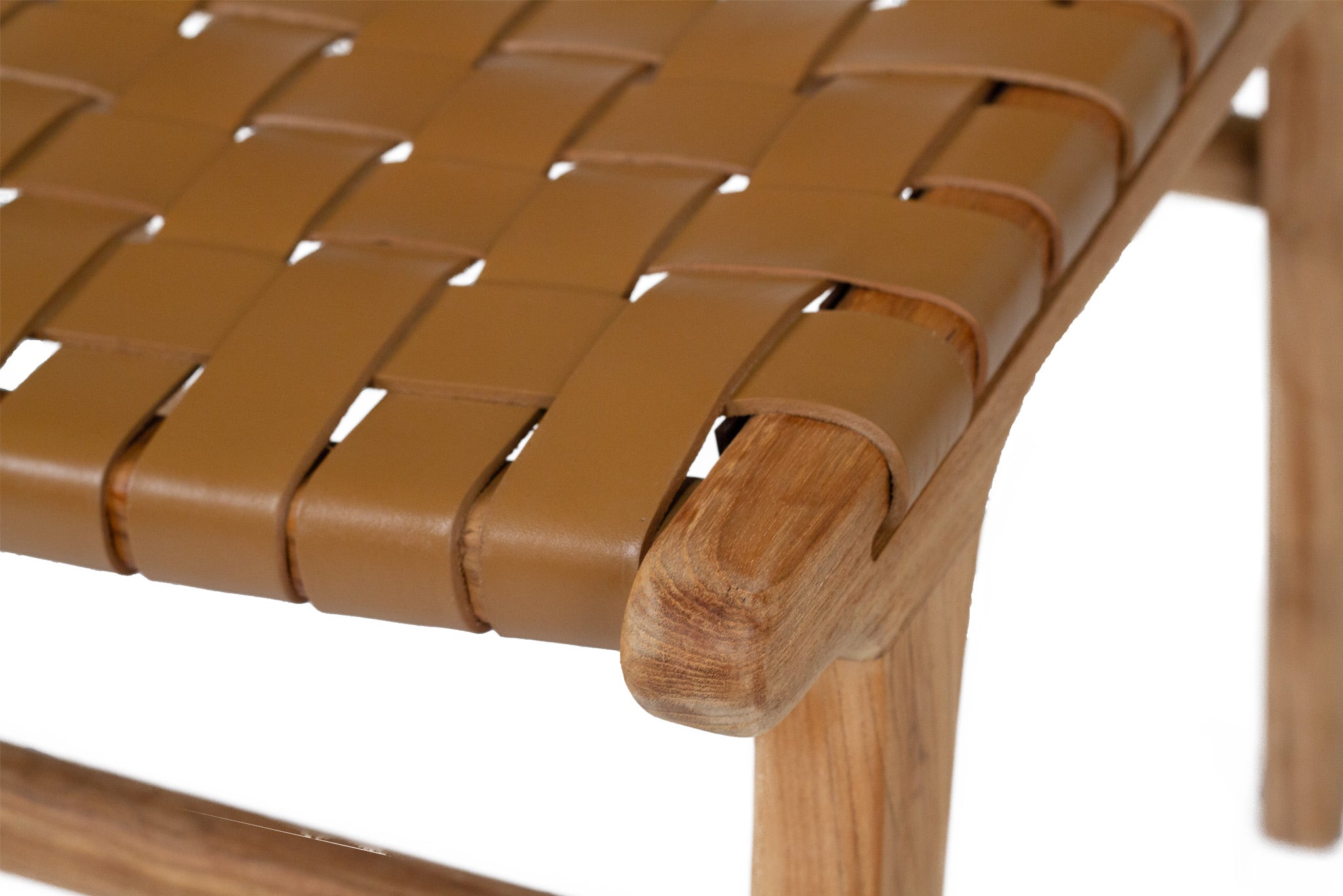 Dining chair with woven leather straps and sleek modern design, crafted for style and comfort. Seat perspective. Magnolia Lane