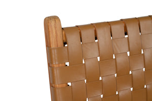 Dining chair with woven leather straps and sleek modern design, crafted for style and comfort. Backrest perspective. Magnolia Lane