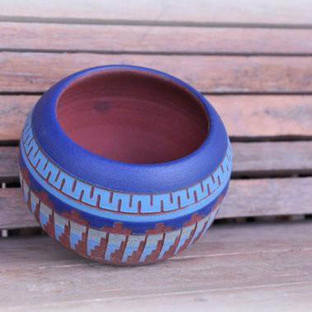 Handcrafted clay pots with desert and turquoise hues, featuring Native American-inspired Aztec and geometric patterns, durable and ideal for modern or eclectic interiors. Front perspective.
