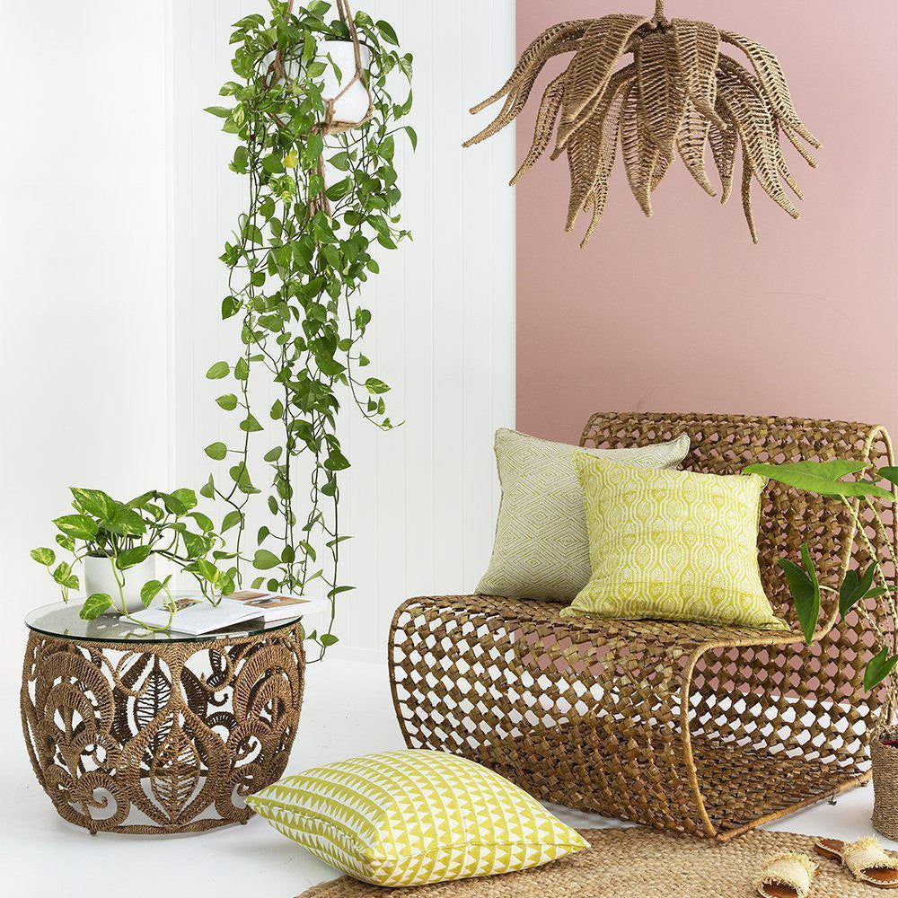 Lotus Chandelier handwoven with seagrass rope over a wrought iron frame, featuring a unique lotus design for a bohemian statement piece.  Magnolia Lane 2