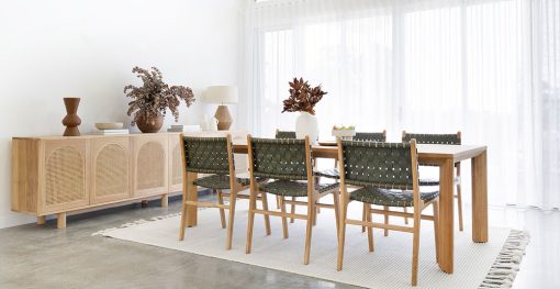 Dining chair with woven leather straps in Olive green and sleek modern design, crafted for style and comfort. Styled beautifully in this modern home interior. Magnolia Lane