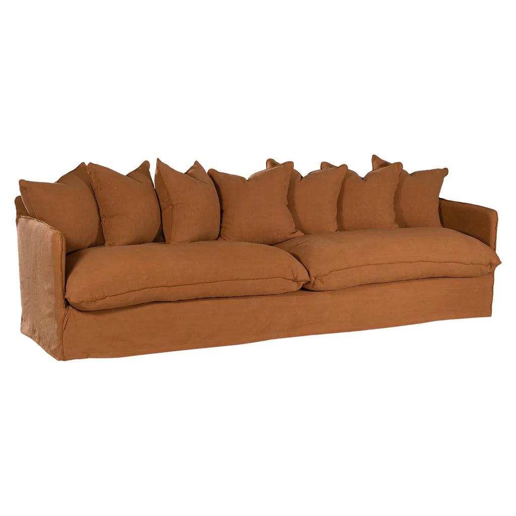 Singita Four Seater Sofa by Uniqwa with hardwood frame, feather-filled cushions and removable slipcovers in luxury linen in clay.
