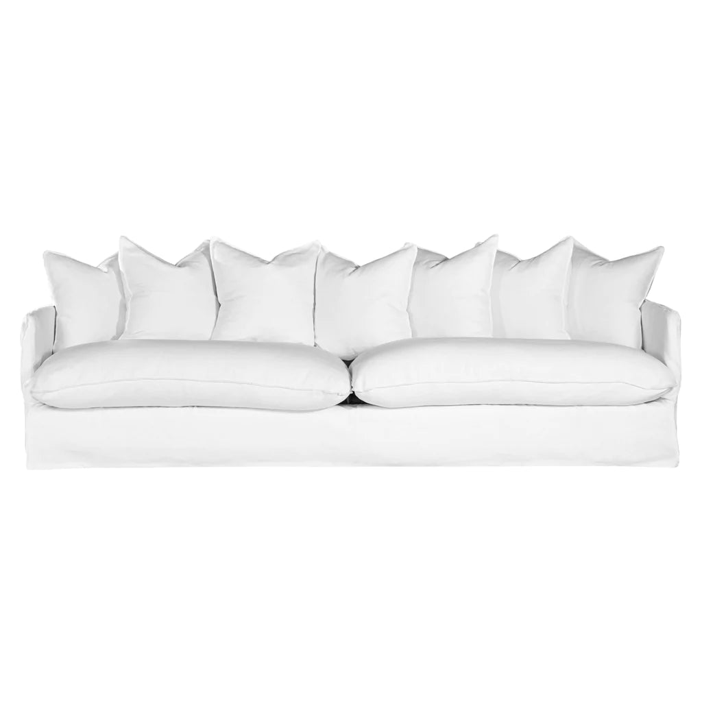 Singita Four Seater Sofa by Uniqwa with hardwood frame, feather-filled cushions and removable slipcovers in luxury linen in white. Front perspective.