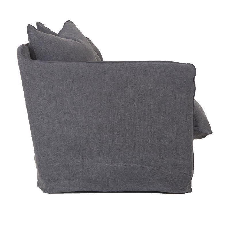 Singita Four Seater Sofa by Uniqwa with hardwood frame, feather-filled cushions and removable slipcovers in luxury linen in Charcoal. Side perspective.
