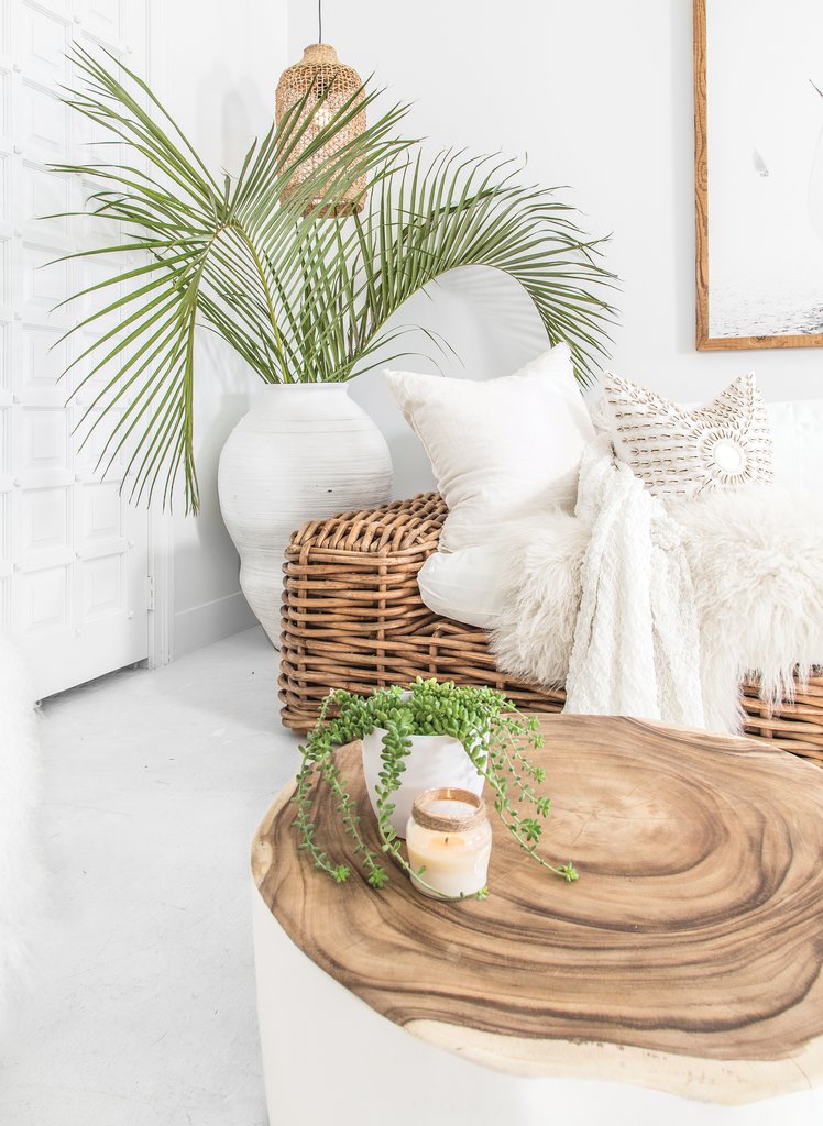 Trunk Coffee Table with a natural timber top styled beside woven seating